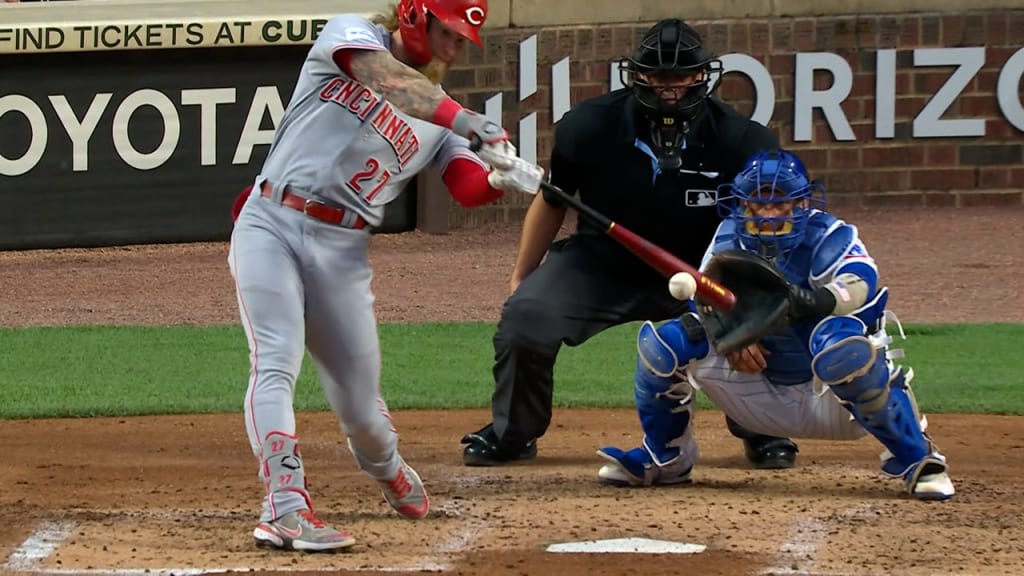 Reds use two three-run innings to beat Cubs