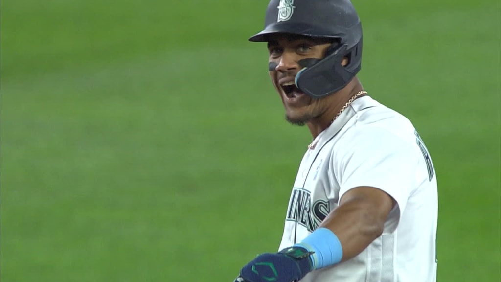 Seattle Mariners' J.P. Crawford breaks his bat on a swing in a