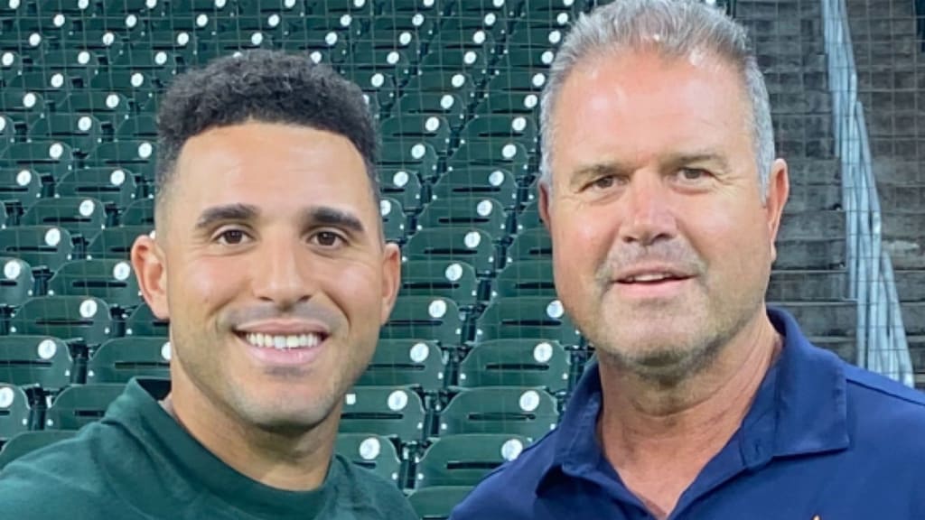 Outfielder Ramón Laureano with Astros scout Jim Stevenson.
