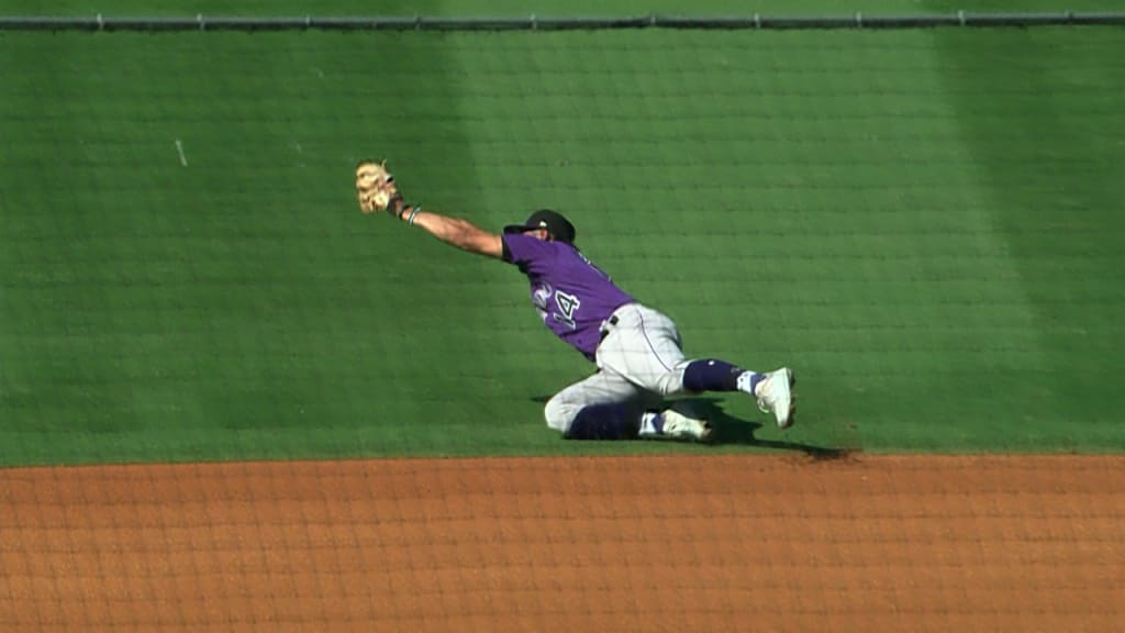 Boston Red Sox SS Trevor Story flips the ball to himself after a