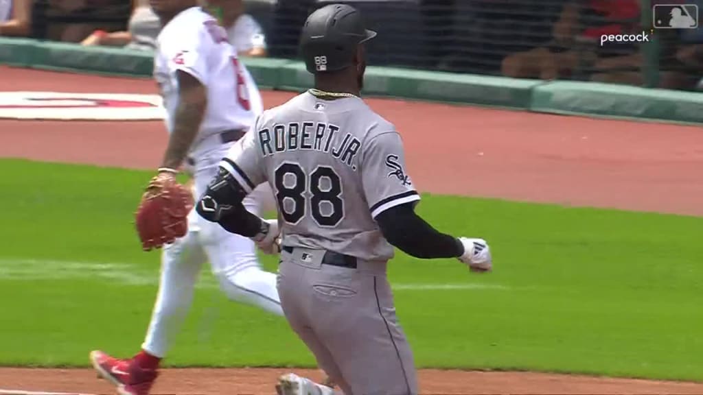 Chicago White Sox's Elvis Andrus, left, puts on the home run Southside  jacket and hat on Luis Robert Jr., right, after Robert hit a solo home run  against the Los Angeles Dodgers