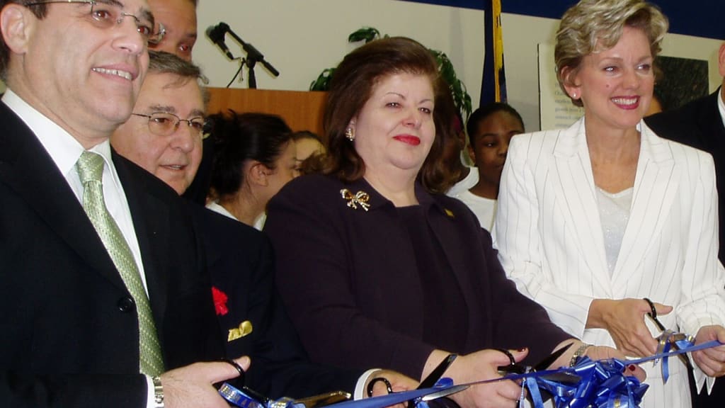 Dr. Haifa Fakhouri (center) attends the ribbon cutting ceremony for the ACC Youth Center.