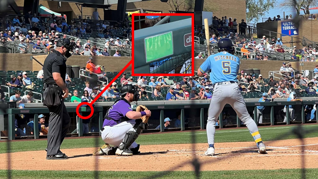 The green index card signals to Garrett Mitchell that the conditions are right to challenge a pitch.
