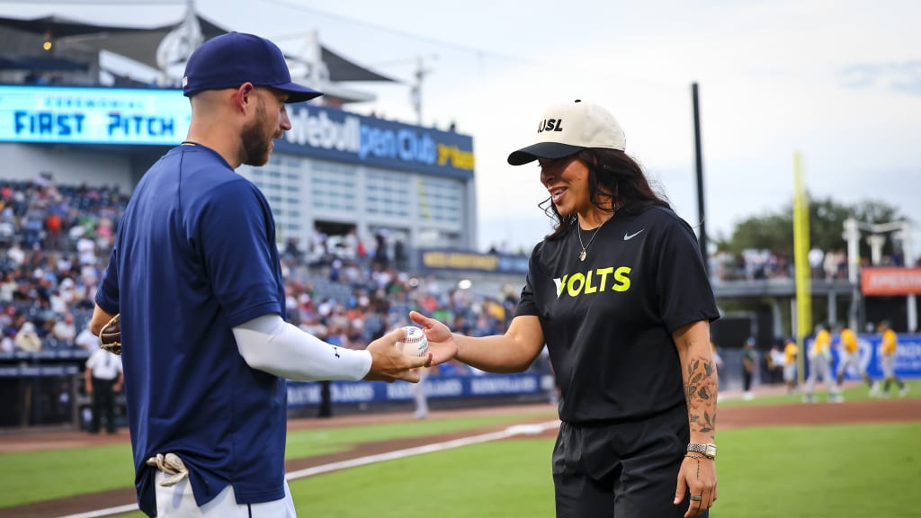 Brandon Lowe handed Sierra Romero a ball after her first pitch.