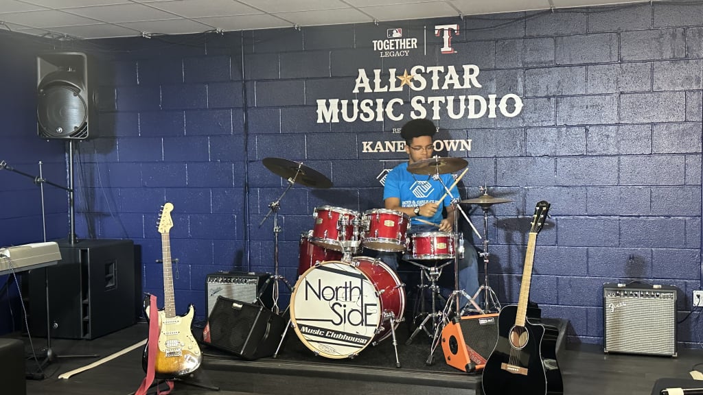 Preston, 15, plays drums at the renovated music studio.