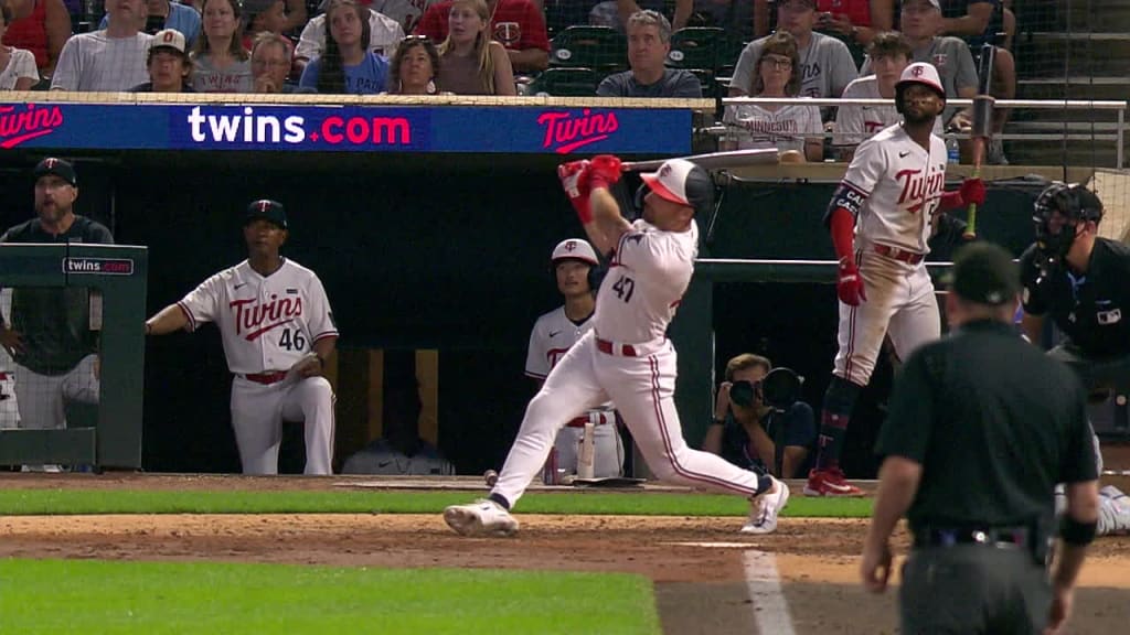 Minnesota Twins' Edouard Julien (47) talks to Carlos Correa