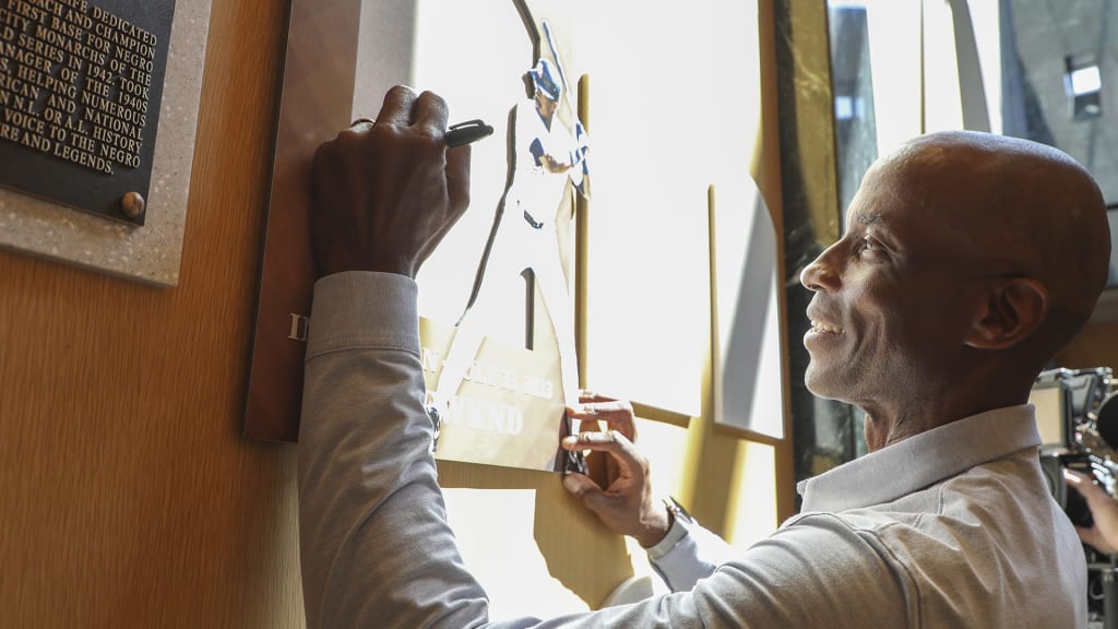 McGriff signs the spot where his Hall of Fame plaque will hang during a visit to Cooperstown on March 28. (Milo Stewart Jr./National Baseball Hall of Fame and Museum)