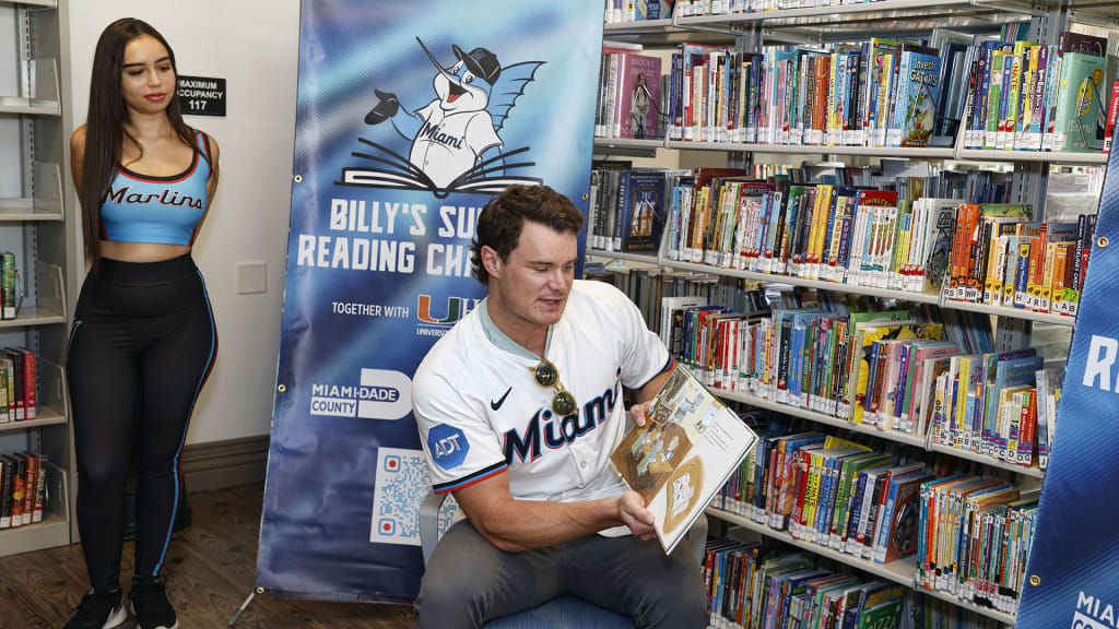 Griffin Conine reads to kids during Billy's Summer Reading Challenge.