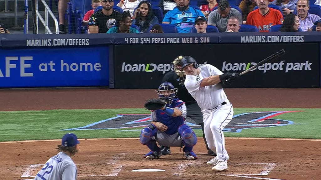 Who is the guy in the Marlins jersey behind home plate at the