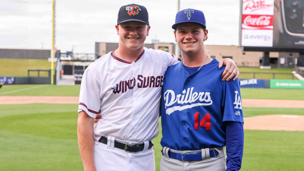 Brothers Louie and Gus Varland (right) pose after facing each other in the Minors. (photo via Ed Bailey-Wichita Wind Surge)