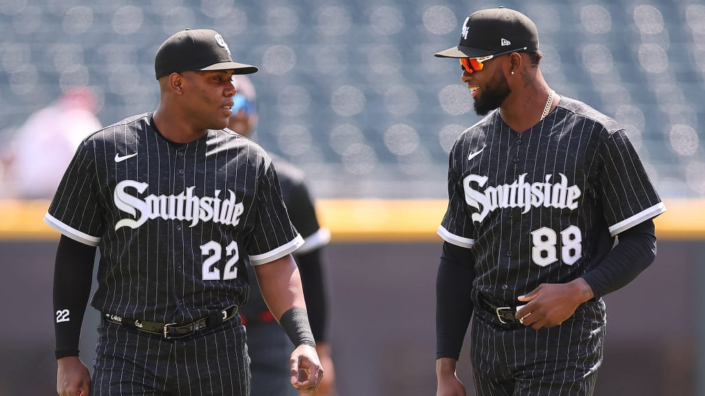 Oscar Colás (L) and Luis Robert Jr. (R) talking before a White Sox game
