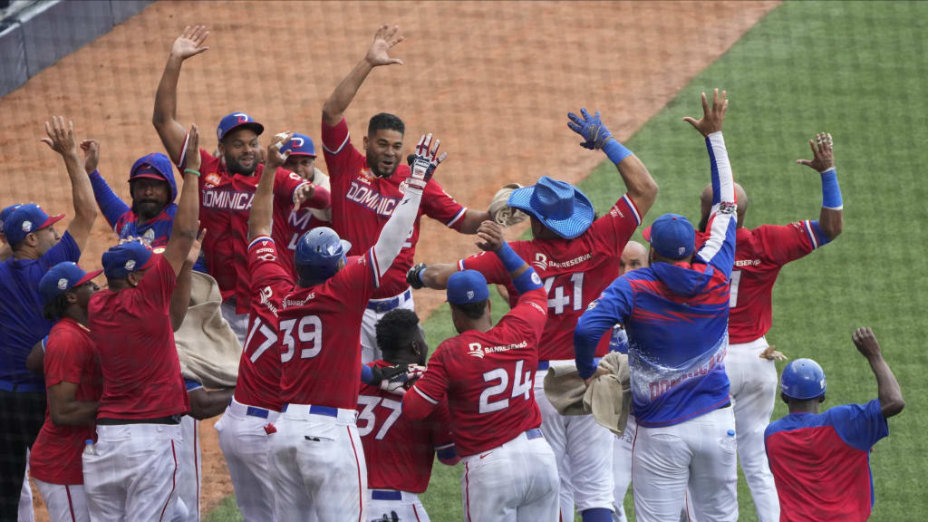 Dominican Republic players celebrate after defeating Curaçao on the final day of pool play.