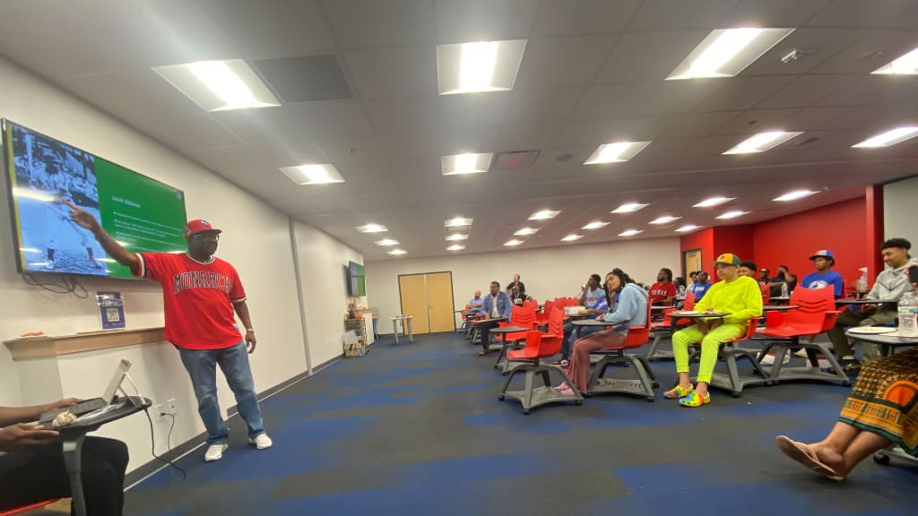 Negro Leagues Baseball Museum president Bob Kendrick speaks to youngsters at the Texas Rangers Youth Baseball Academy.