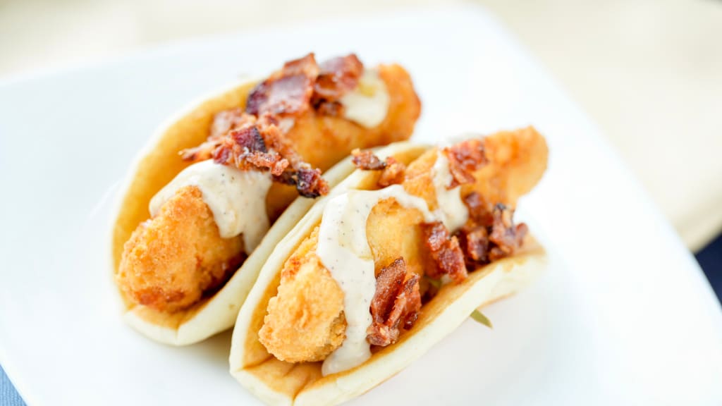 The Double Chicken 'n' Pancakes  Pocket Pack is topped with chopped bacon and a maple syrup drizzle.