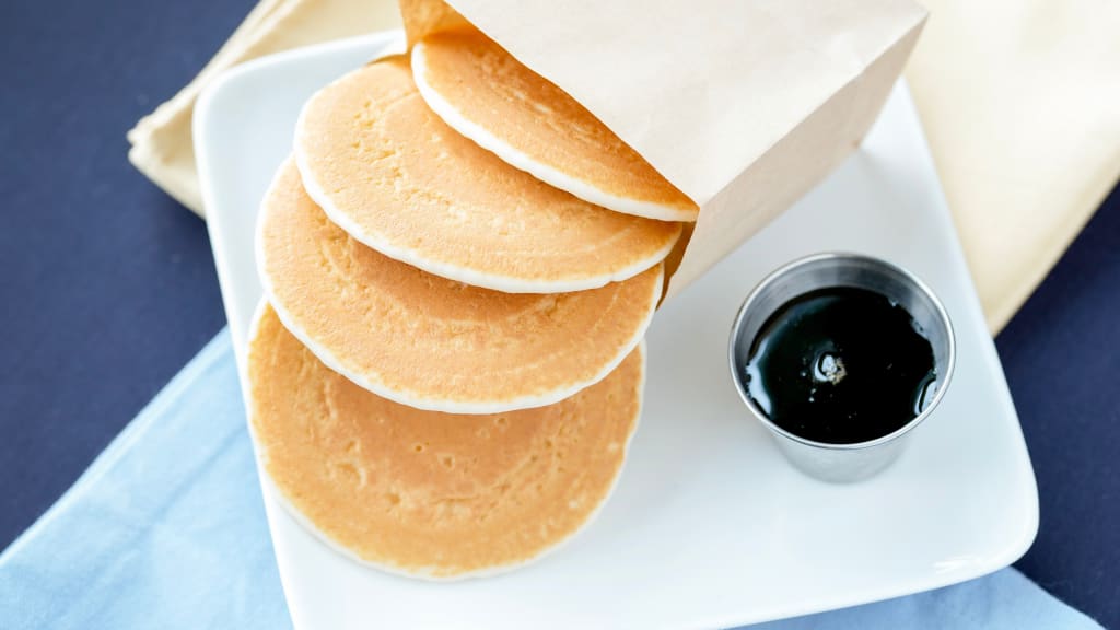 The Ball Four Pocket Pack includes four pocket pancakes and a choice of maple syrup or strawberry compote dipping sauce.
