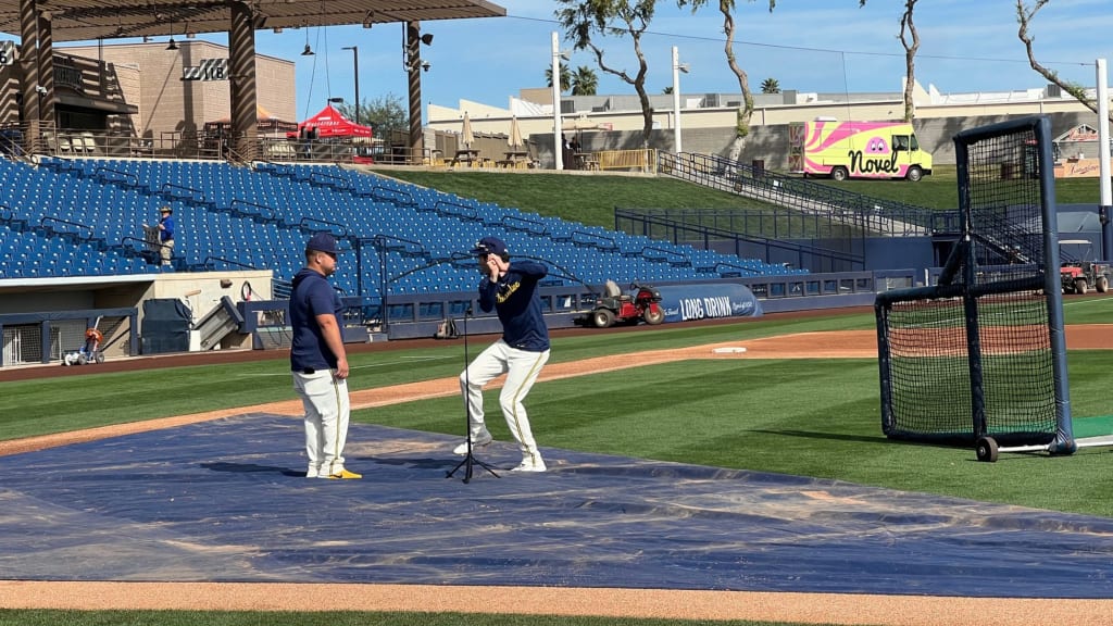 Daniel Vogelbach (left) works with Christian Yelich. (photo via Adam McCalvy)