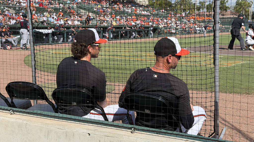 Joe Singley, left, sits next to Craig Albernaz during an O's Spring Training game on Saturday.