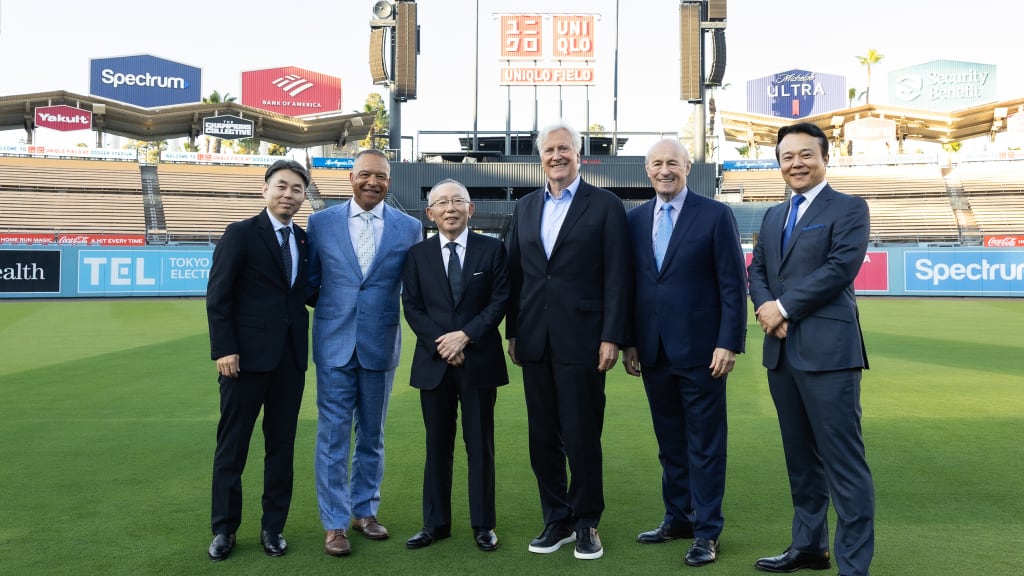 Koji Yanai, Dave Roberts, Tadashi Yanai, Mark Walter, Stan Kasten, Daisuke Tsukagoshi at UNIQLO Field at Dodger Stadium. (Jason Sean Weiss/BFA.com)