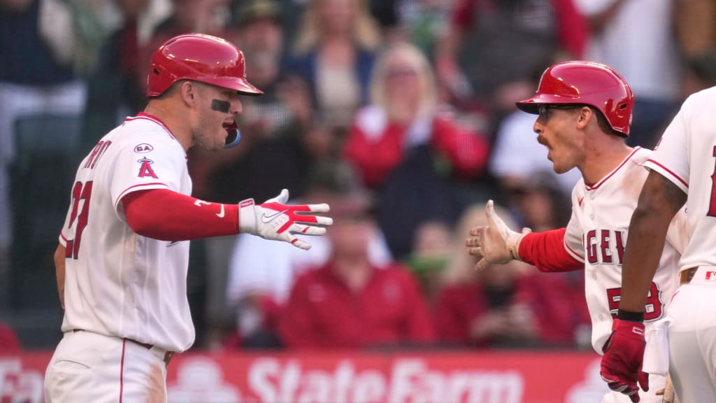 Angels star Mike Trout greets Wade Meckler after his first-inning home run against the Rangers. (AP)