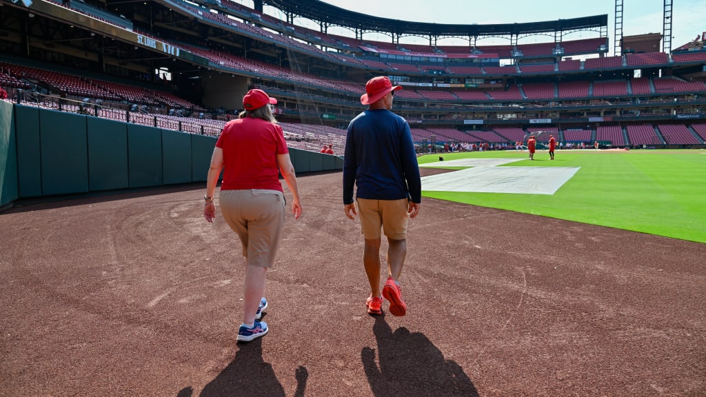 "They were so nice to this old woman who came out there to invade their territory," Amos said of the Cards' ground crew.