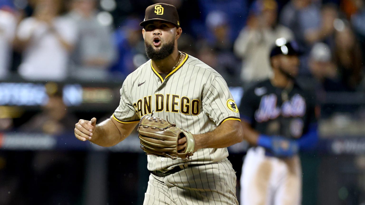 Padres pitcher Luis Garcia celebrates after getting a big out