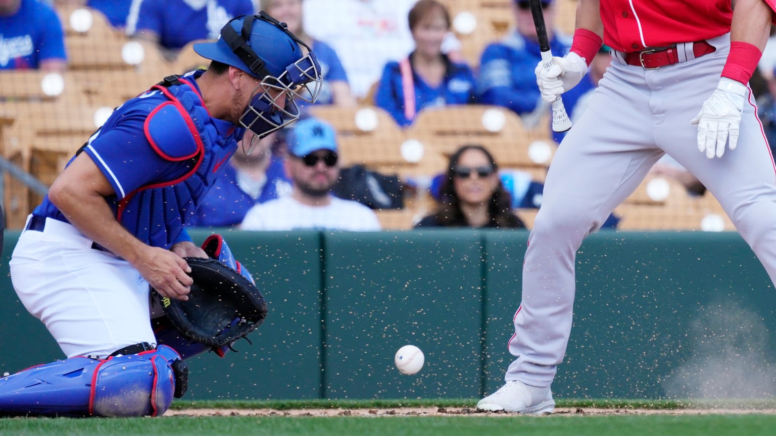 A catcher blocks a pitch in the dirt