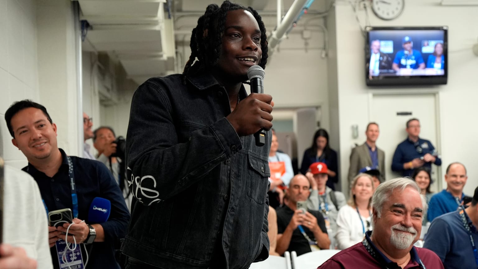 A's outfielder Lawrence Butler asks a question at a World Series press conference