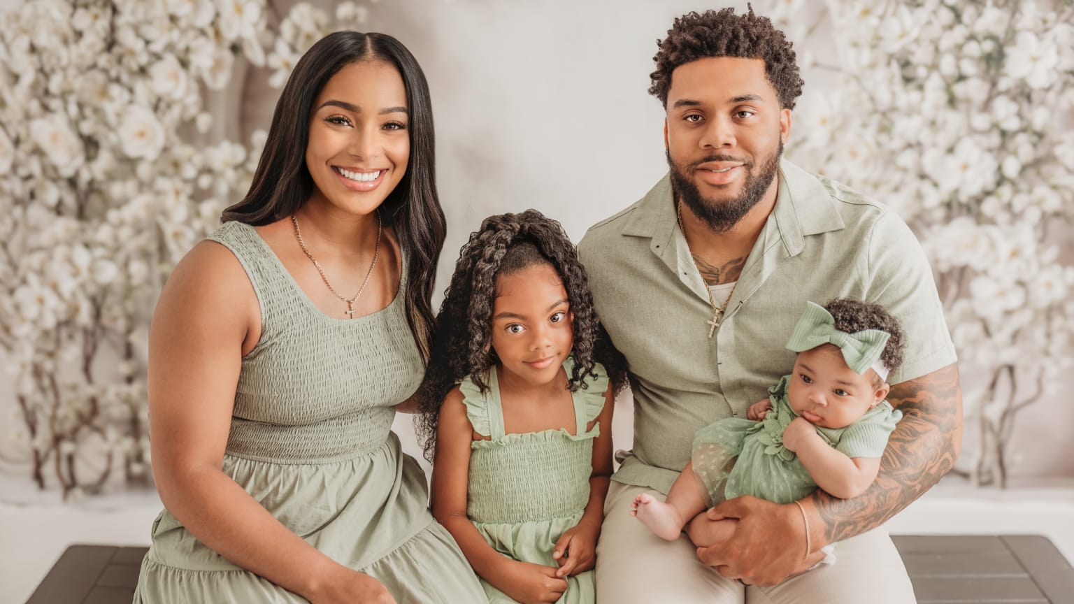 Odicci Alexander-Bennett and her stepdaughter, husband Hakeem, and baby Halo