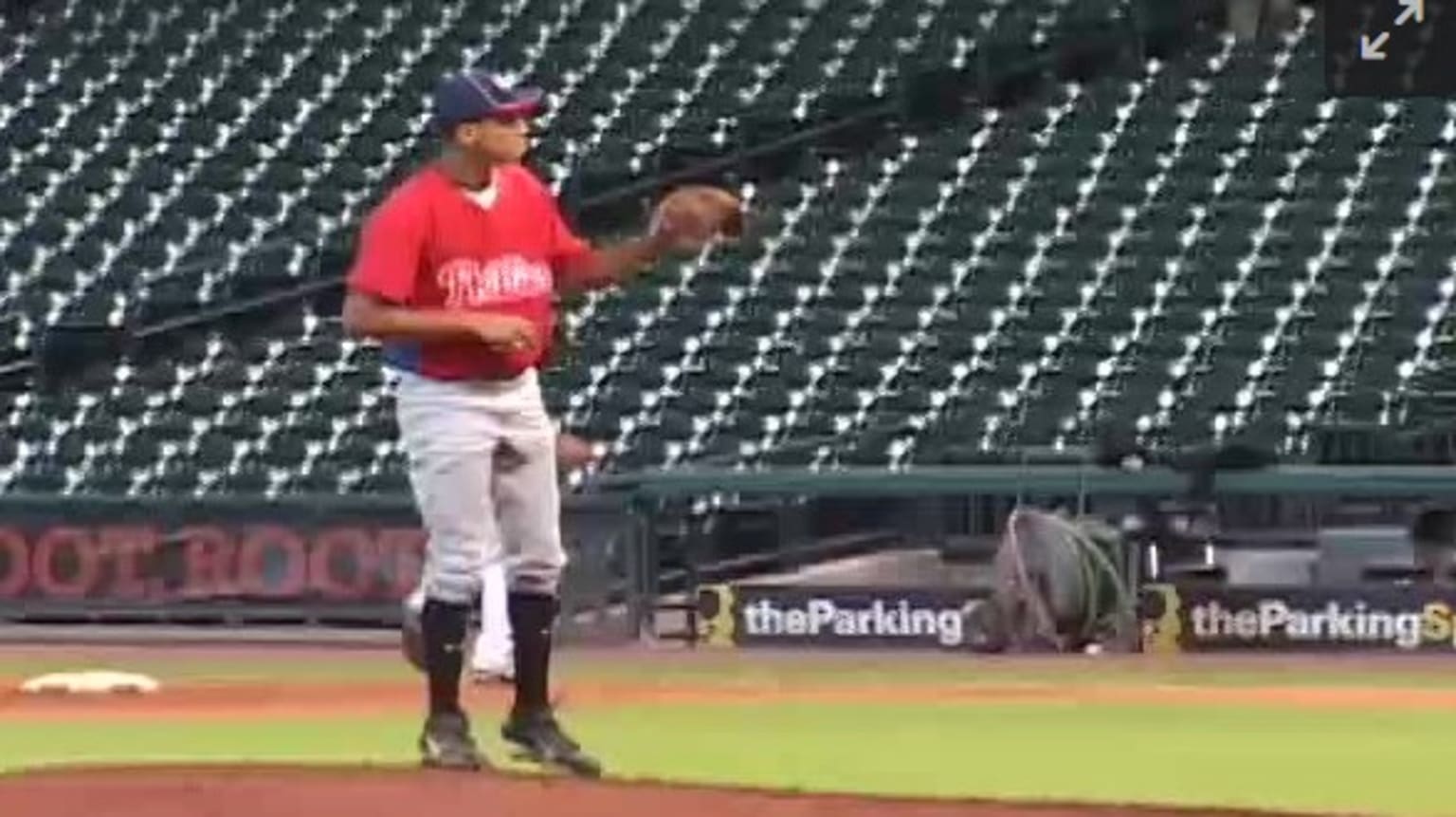 Patrick Mahomes stands on a pitching mound wearing a Phillies uniform