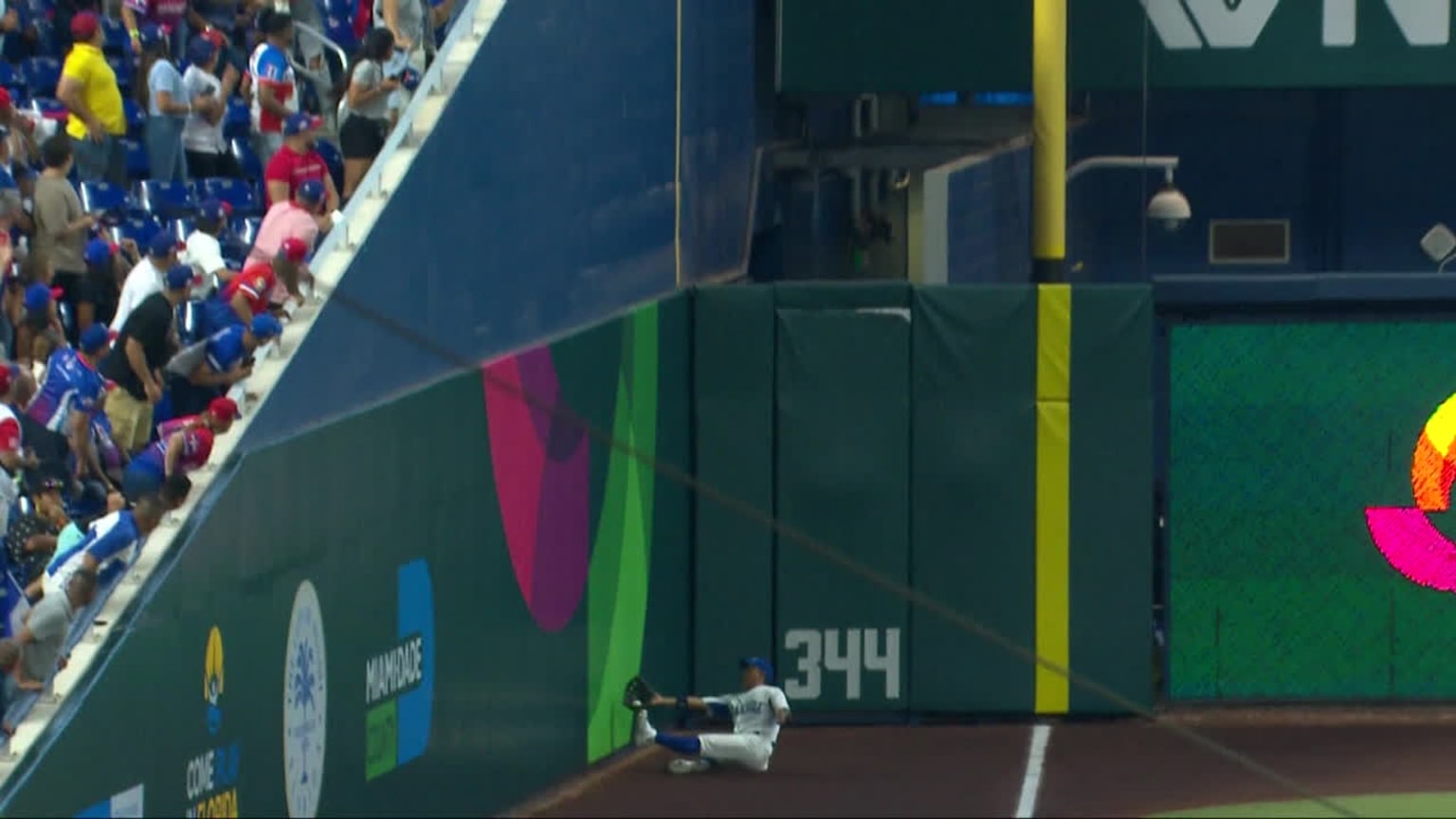A screengrab of a player sliding against a wall in foul territory