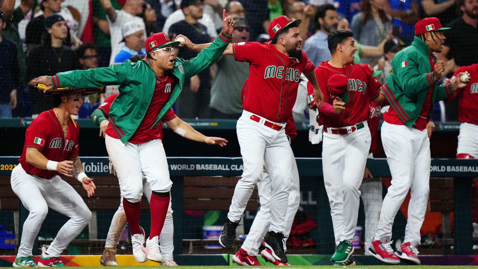 Players on Team Mexico leap in celebration