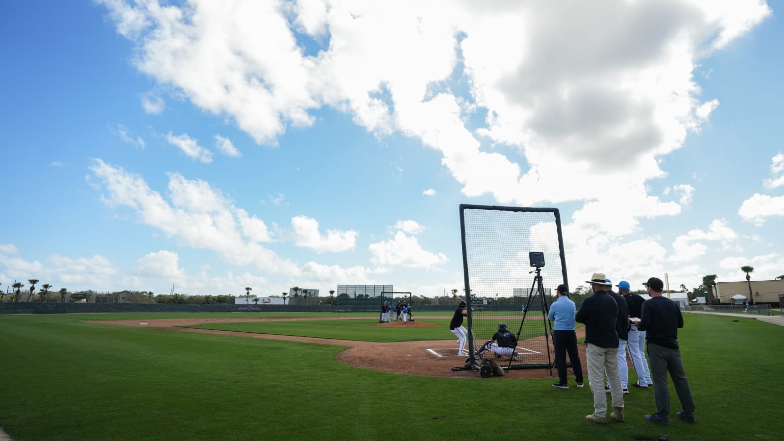 White clouds float over a practice field in Spring Training