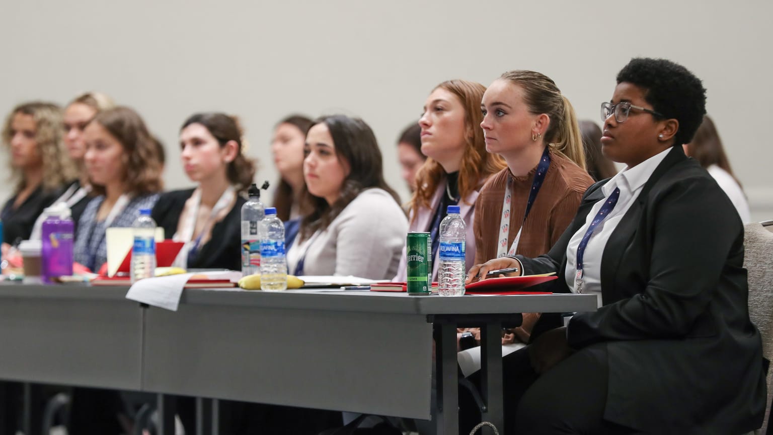 Women listen to a presentation