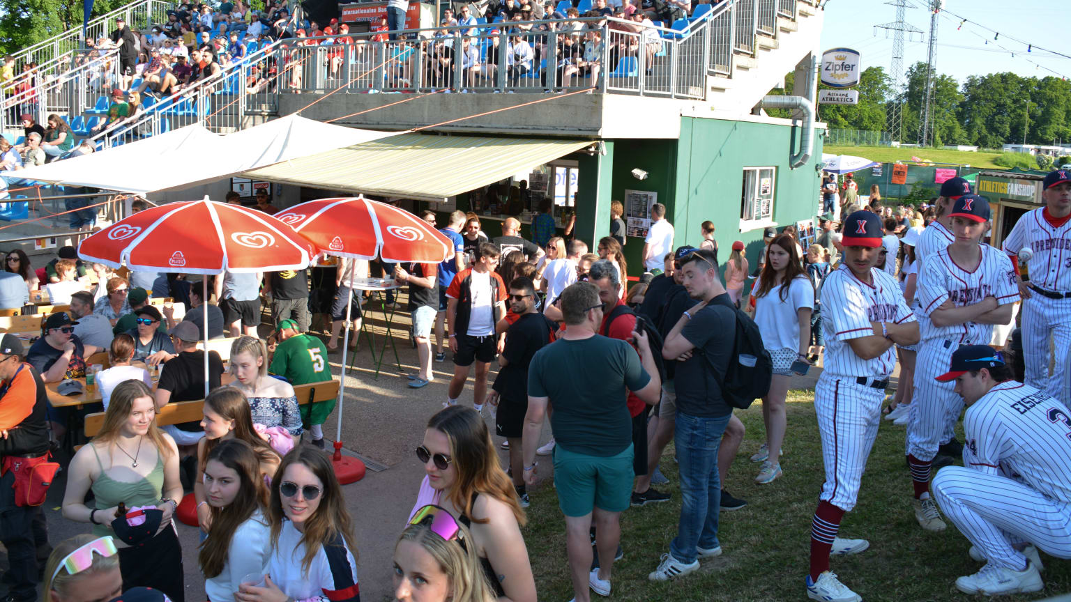 A crowd of fans and ballplayers