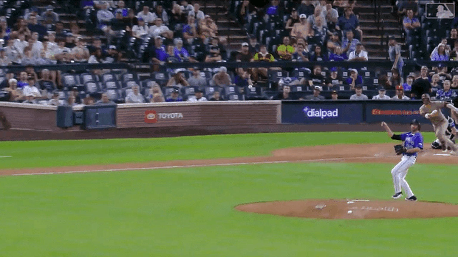 An animated gif of Rockies second baseman Connor Norby making a diving play on a line drive up the middle