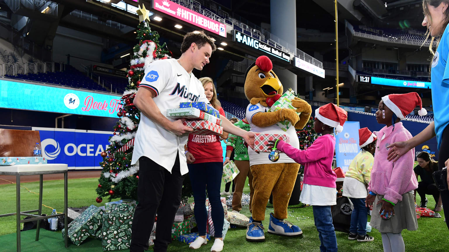 Marlins outfielder Griffin Conine hands out gifts