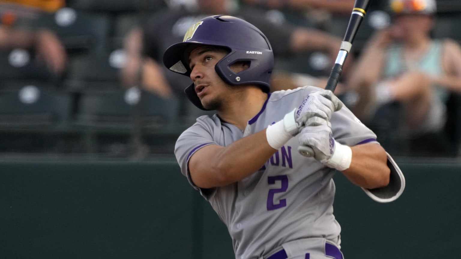 University of Washington player Johnny Tincher follows through on a swing