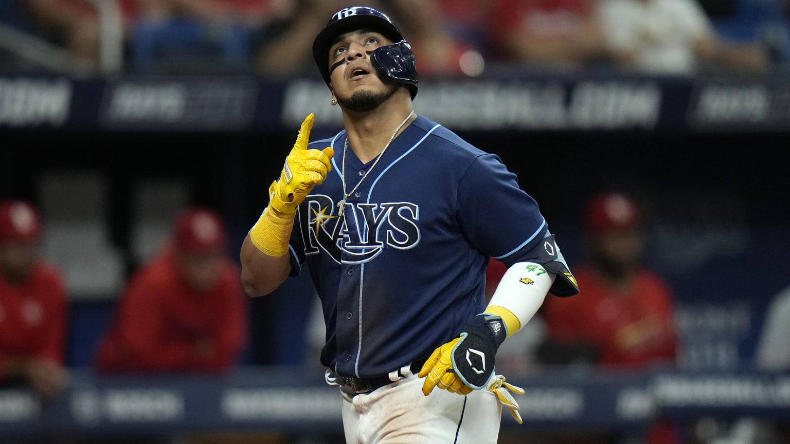 The Rays' Isaac Paredes points to the sky after hitting a home run