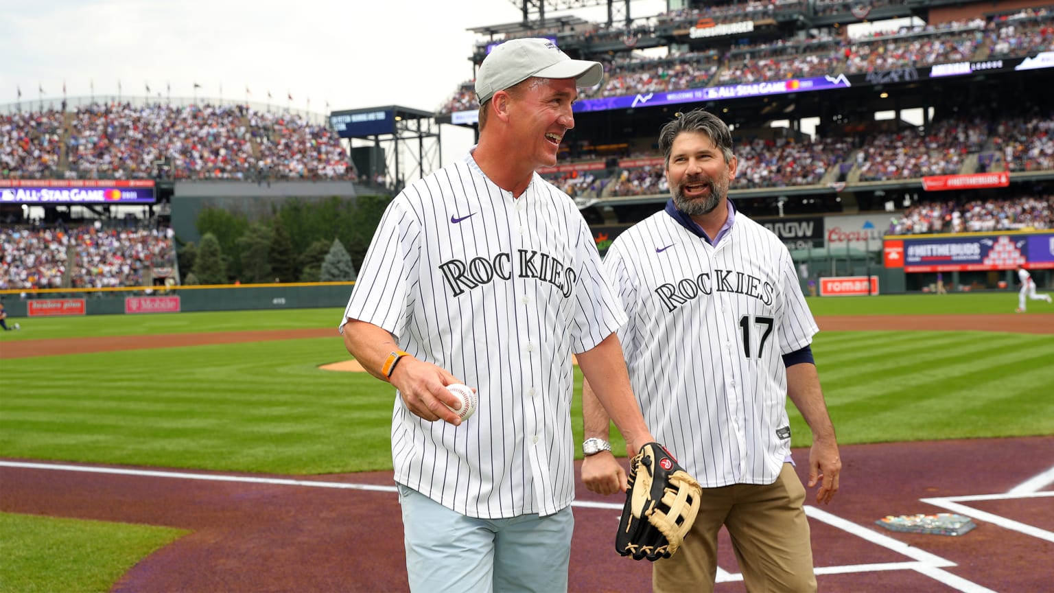 Peyton Manning and Todd Helton together on field at Coors Field