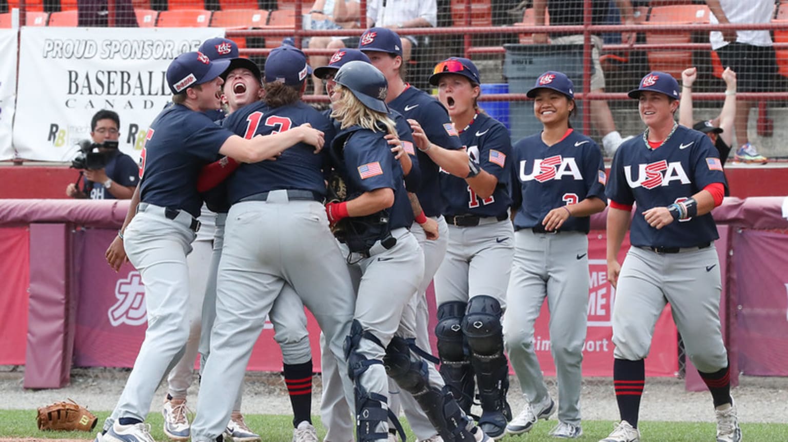 Team USA celebrates its win over Japan in the Women's Baseball World Cup