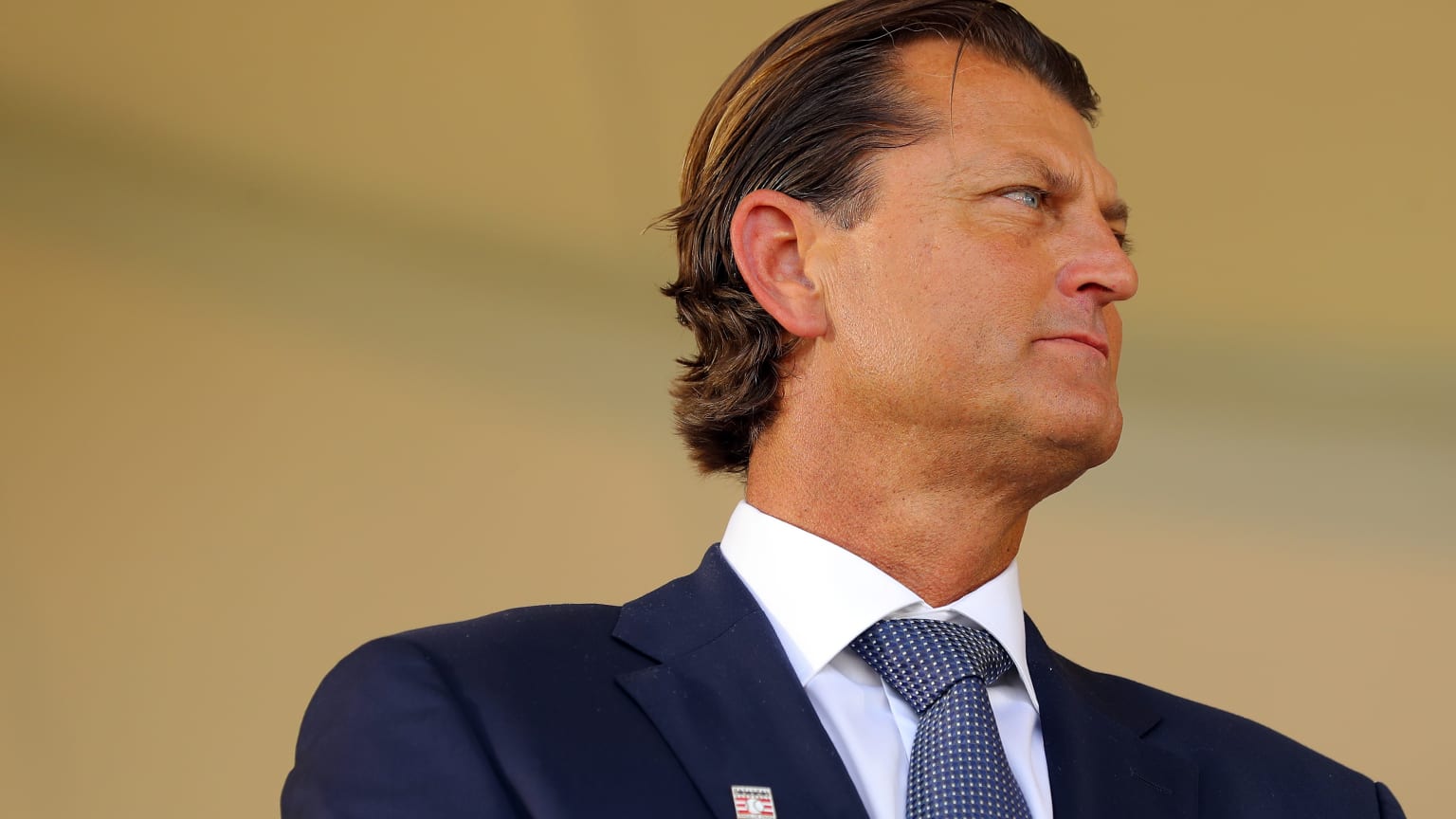 Trevor Hoffman in a suit and tie on the Hall of Fame stage