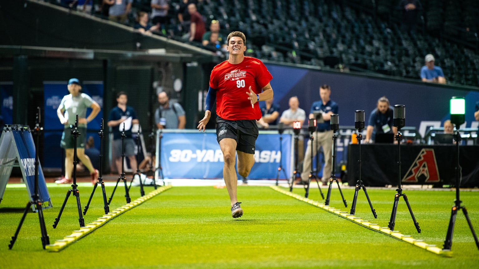 A prospect sprints during the MLB Draft Combine