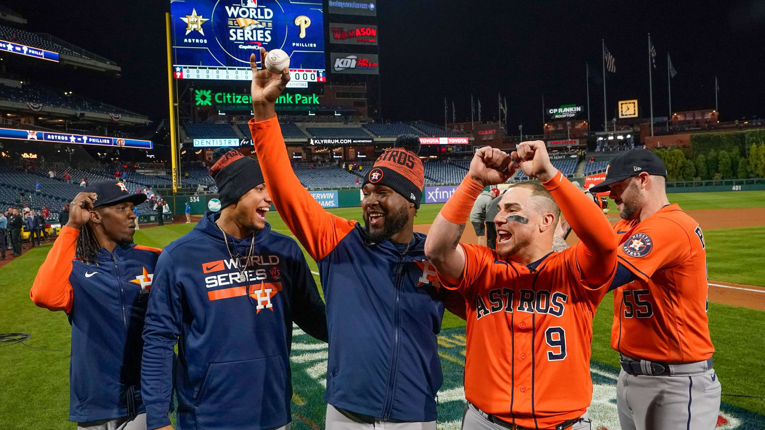 5 Astros celebrate their no-hitter after the game, with one in the center holding up a ball