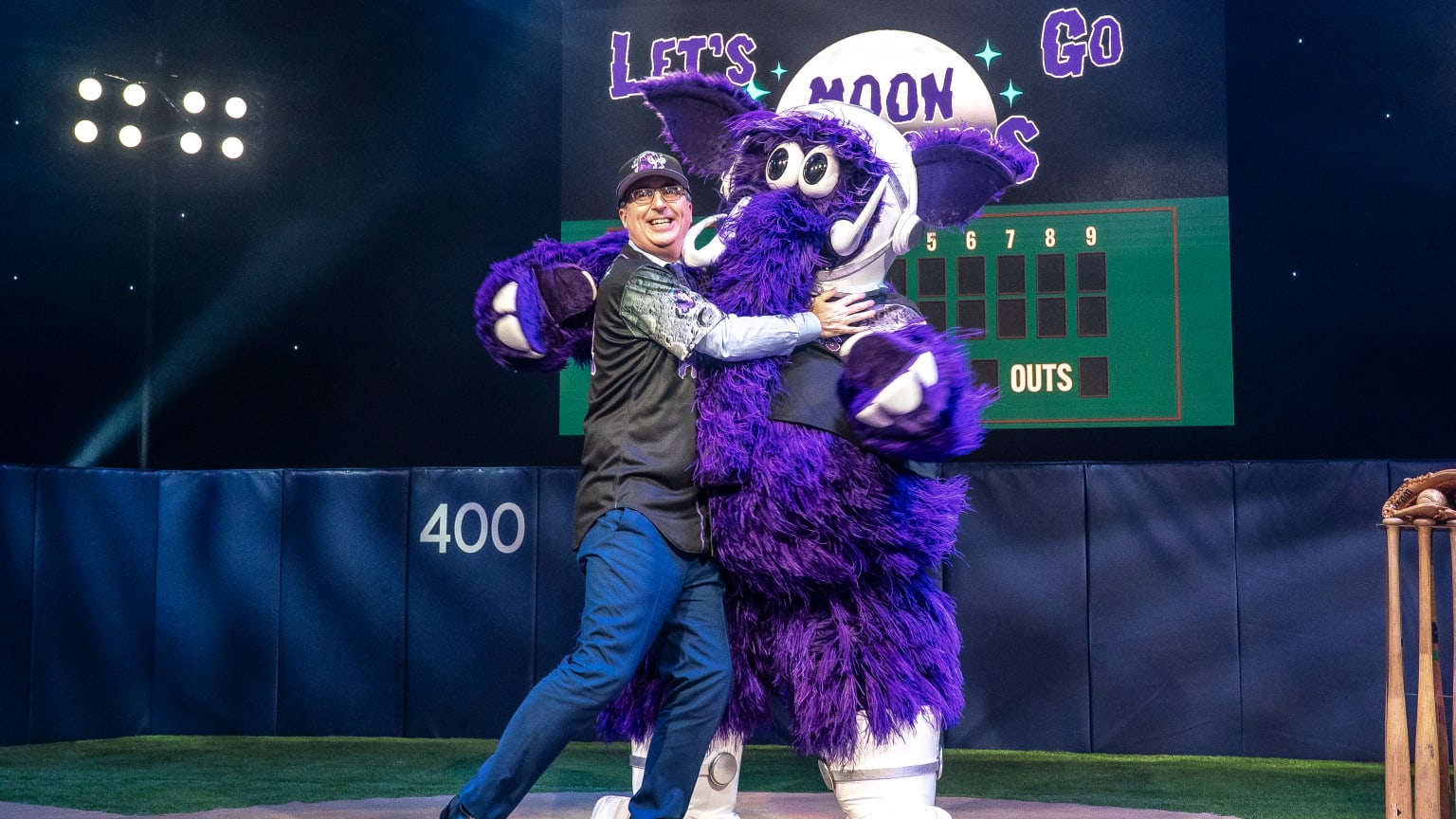 John Oliver hugs the new Erie Moon Mammoth mascot