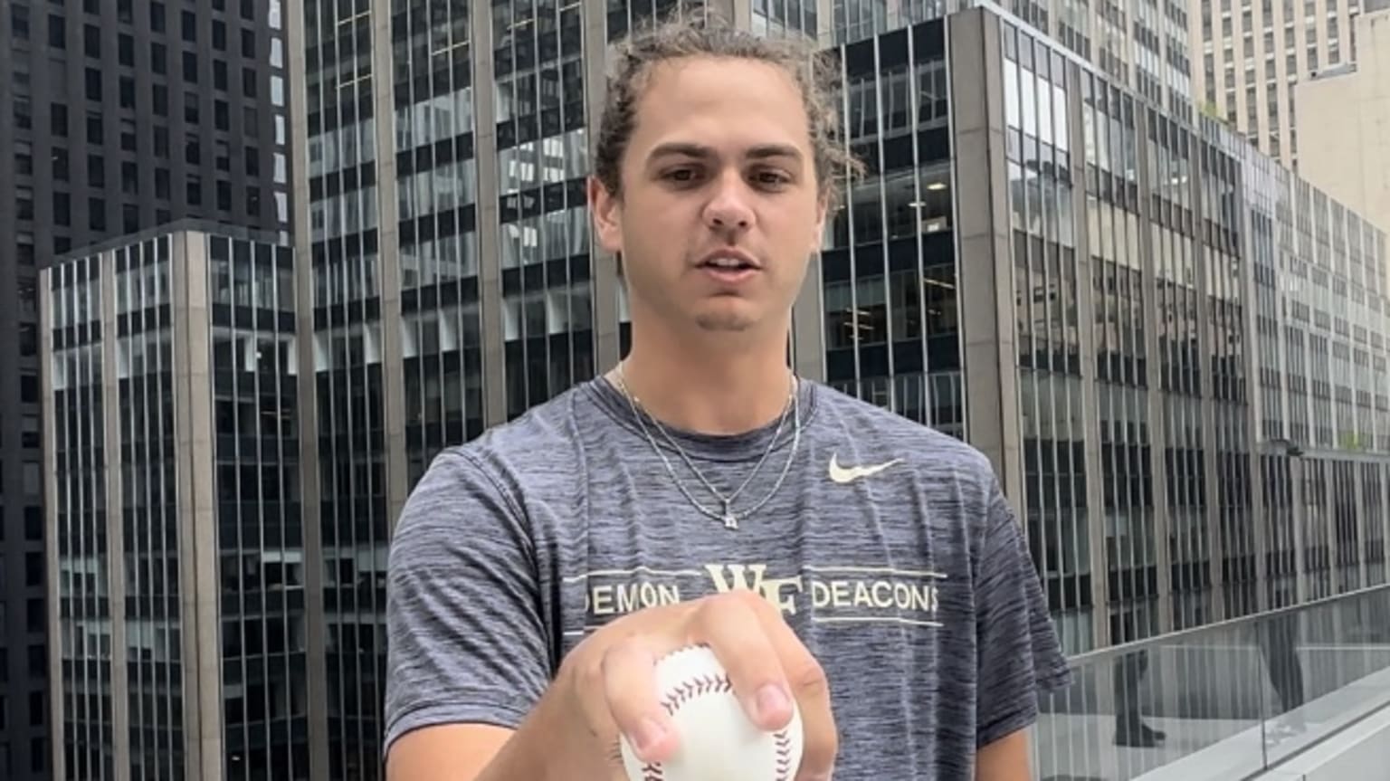 Former Wake Forest pitcher and Draft prospect Rhett Lowder shows one of his pitching grips