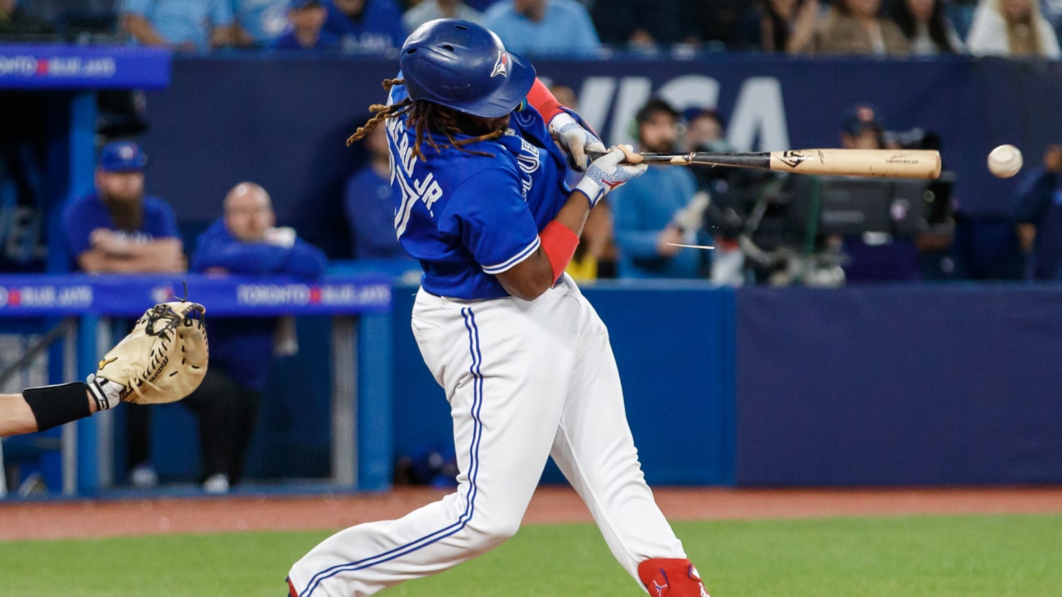 Vladimir Guerrero Jr. follows through on a swing while hitting a double