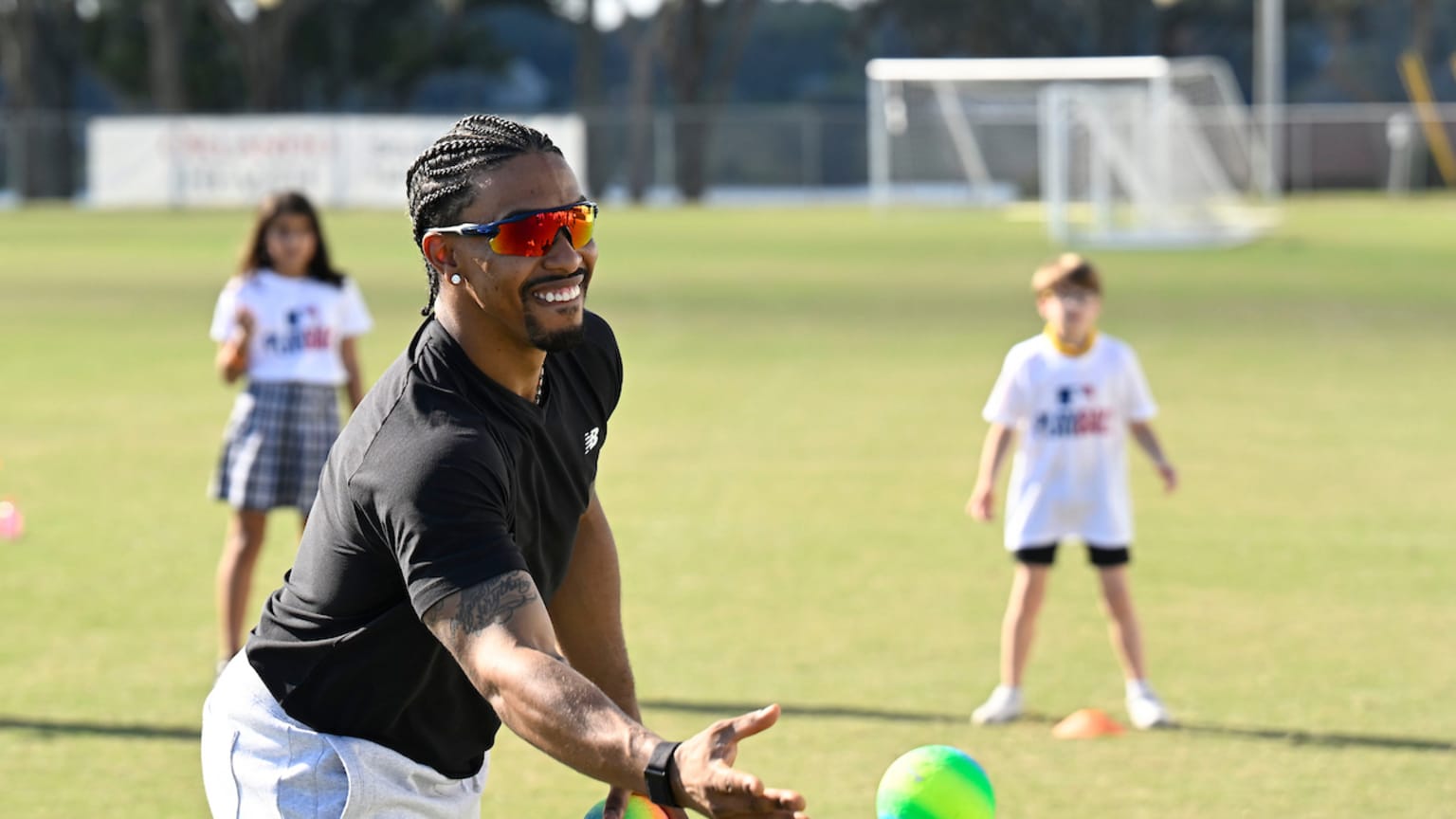 Francisco Lindor pitches at a Play Ball event in Florida