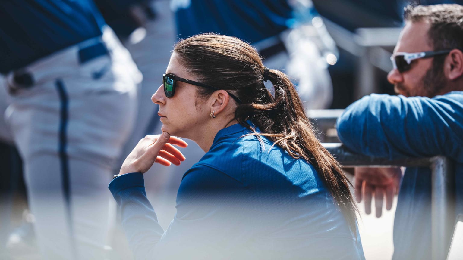 Melissa Lambert watches a game from the dugout