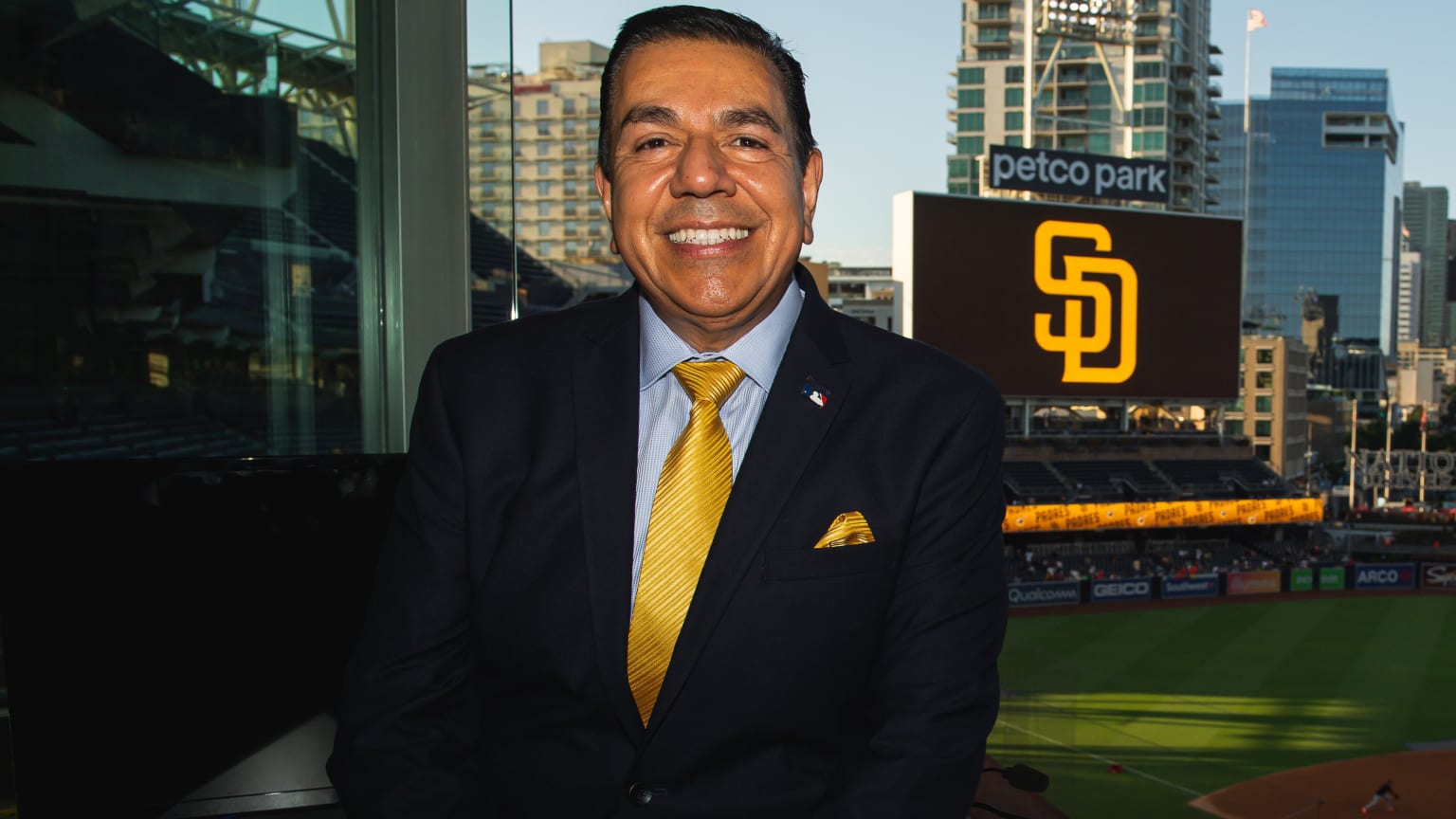 Padres broadcaster Eduardo Ortega poses for a photo at Petco Park