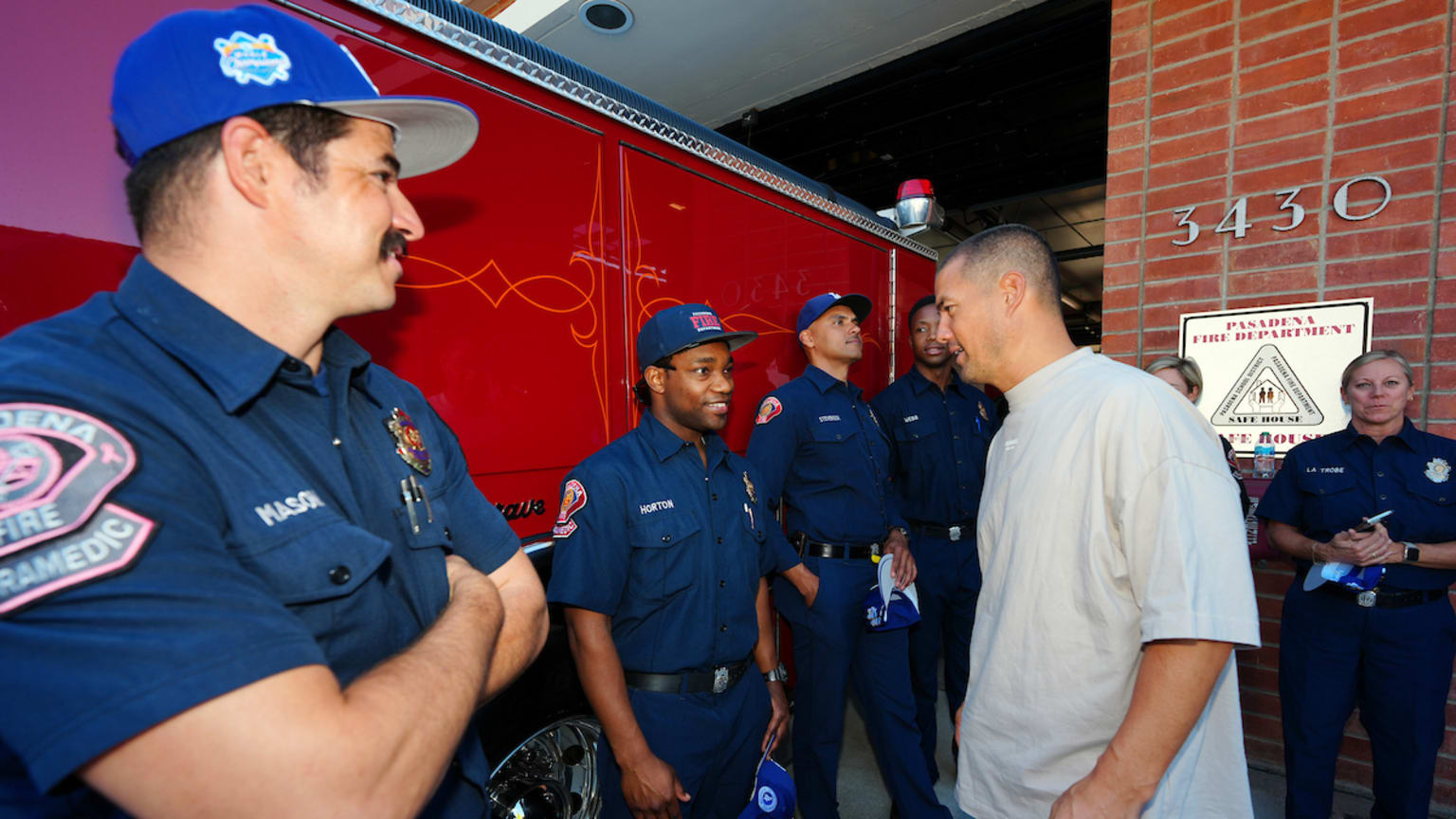 Former pitcher Jeremy Guthrie speaks with members of the Los Angeles Fire Department